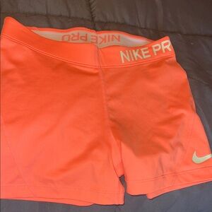 Nike Women's Bright Coral Athletic Shorts
